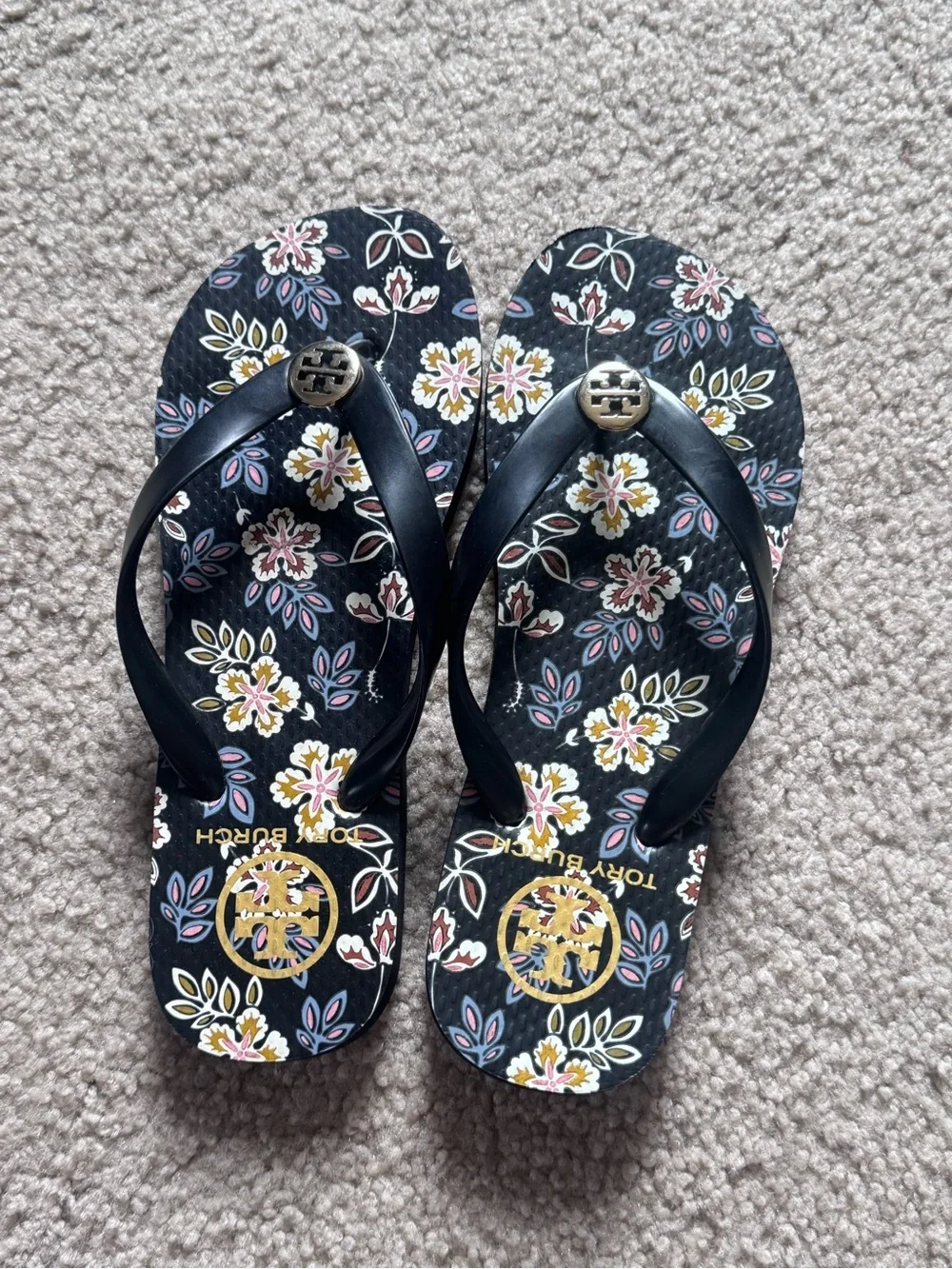 Tory Burch Black Floral Flip Flop Sandals with Gold Emblem